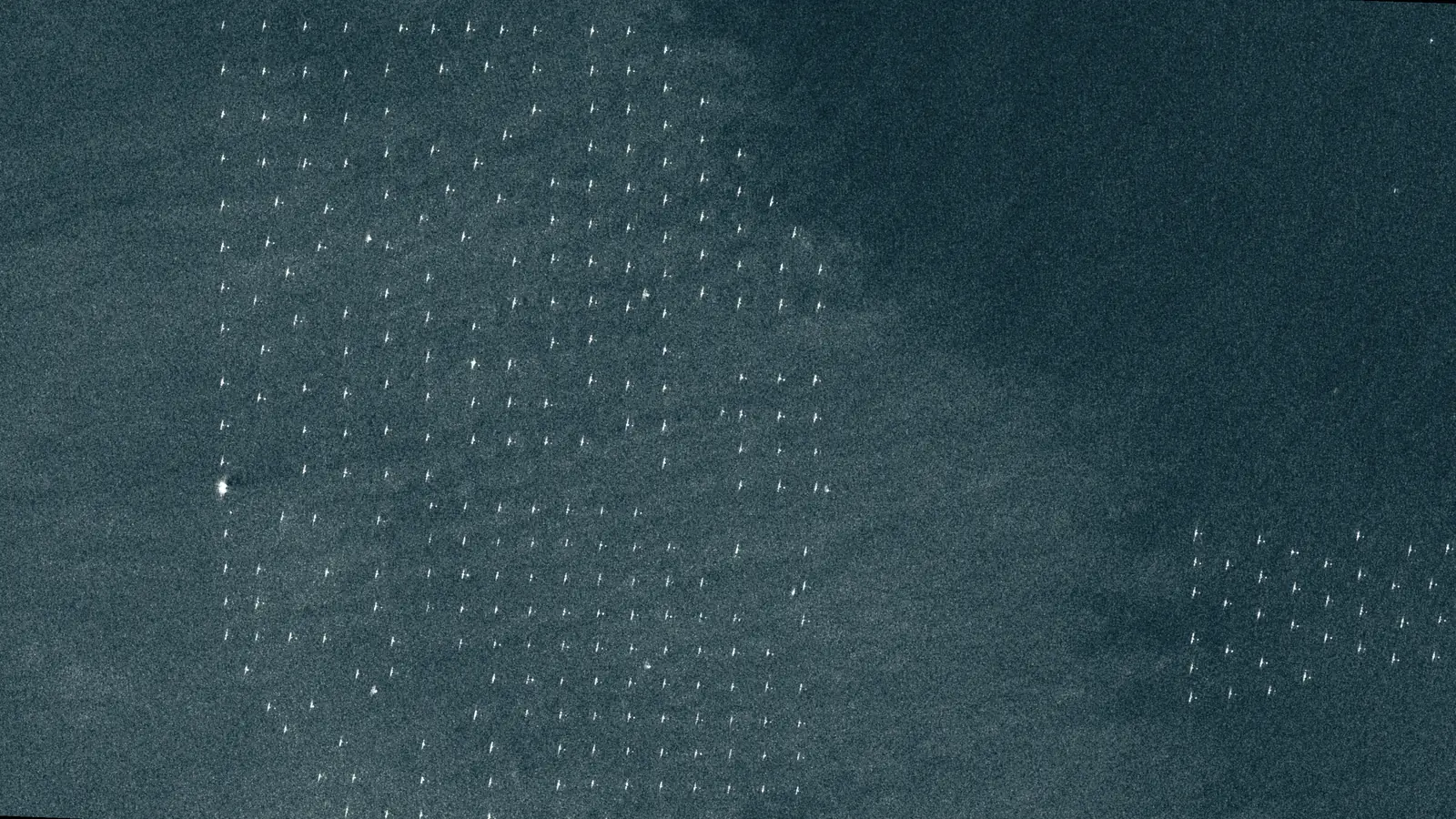 Sentinel-1 VV backscatter image over an offshore wind development area in the German North Sea on 7 June 2026, showing regularly spaced bright surface targets